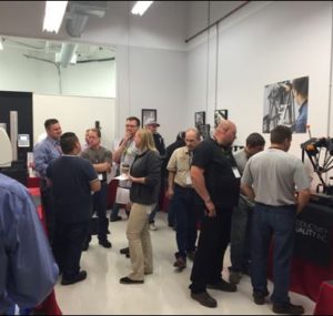 Attendees wandering the booths at the Oktoberfest Tool Show